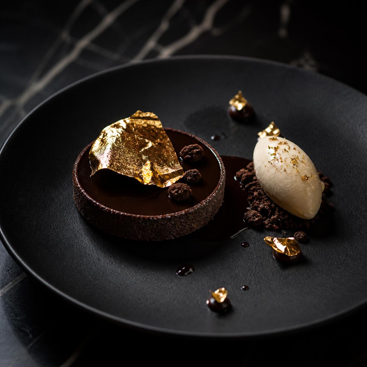 Chocolate rum tart finished with gold leaf